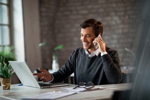 business owner cultivates positive relationship with client by connecting with them via phone call. 