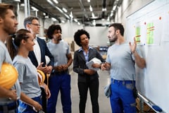 Worker conducts a training session with employees.