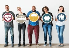 five happy people each holding a sign that represents employee benefits