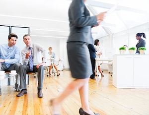 sexual harassment men gossiping about female colleague