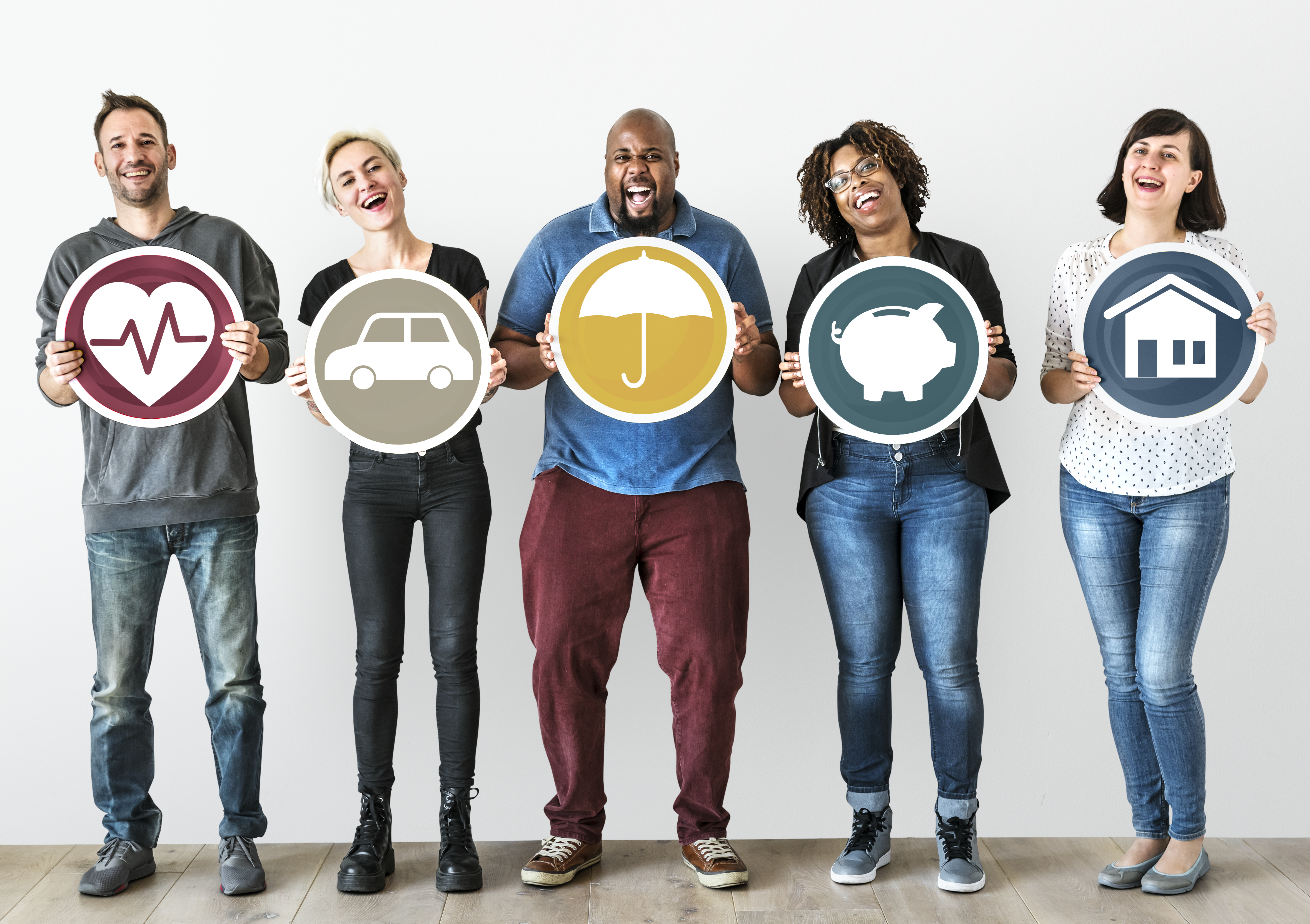 five happy people each holding a sign that represents employee benefits